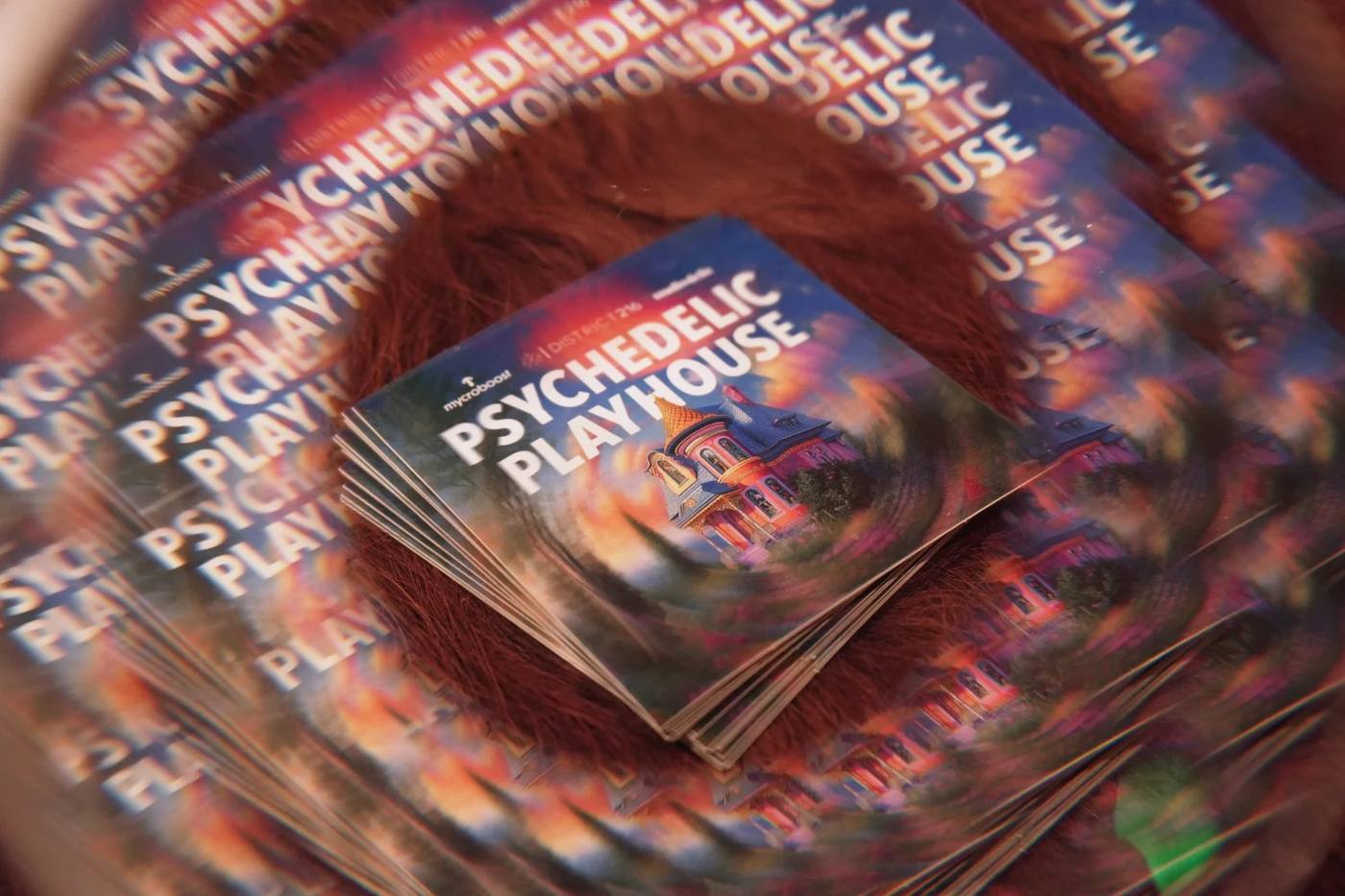A swirl of Psychedelic Playhouse flyers fanned into a spiral.